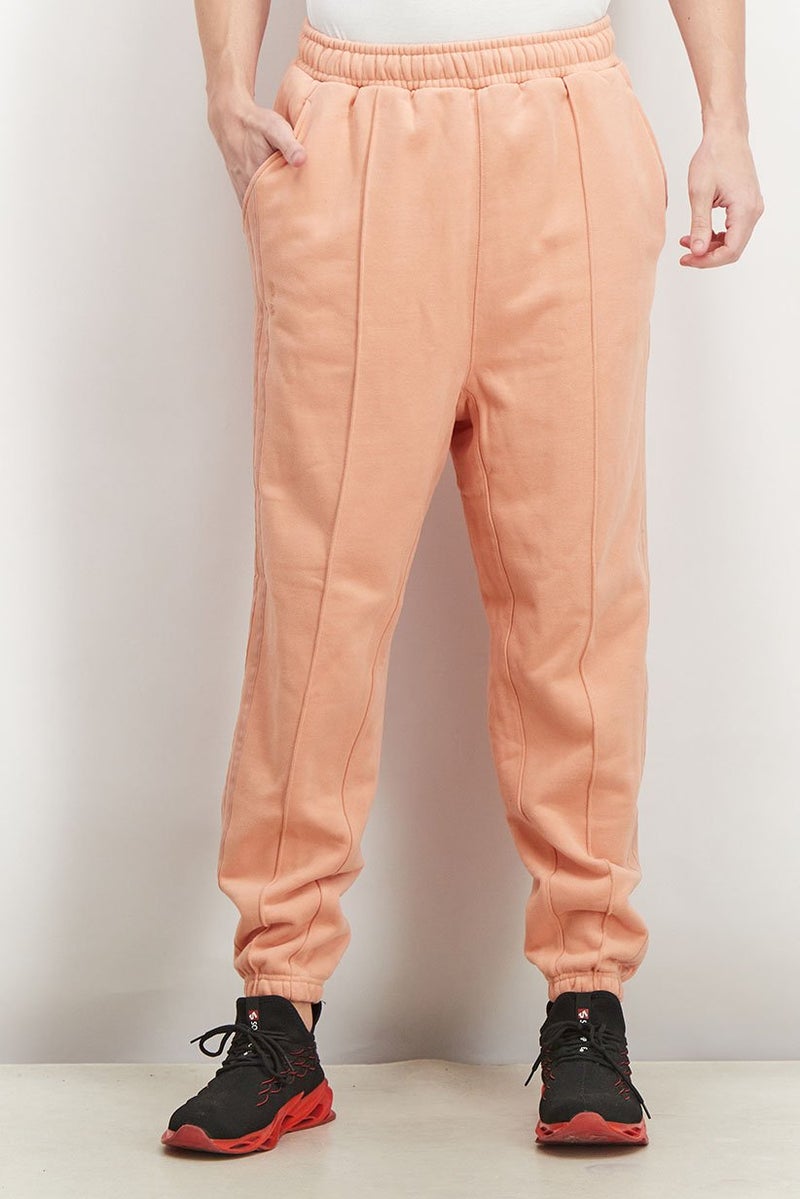 Adidas سروال تدريب رياضي للرجال من أديداس × آيفي بارك، برتقالي - Image 1